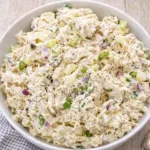 A bowl of creamy Classic Chicken Salad with chives.