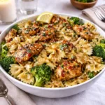 Cowboy Butter Lemon Bowtie Chicken with Broccoli in a white bowl