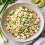 Fresh and creamy Cucumber Shrimp Salad in a glass bowl on a marble counter