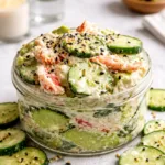 A fresh bowl of Easy California Roll Cucumber Salad with avocado and crab.