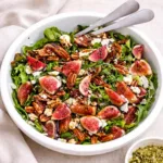 Fig Salad with Arugula and Pecans in a wooden bowl