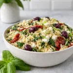 Homemade Orzo Pasta Salad with Feta and Sun Dried Tomatoes in a bowl