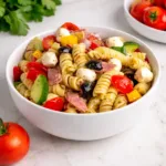 A vibrant bowl of Zesty Italian Pasta Salad with fresh vegetables.